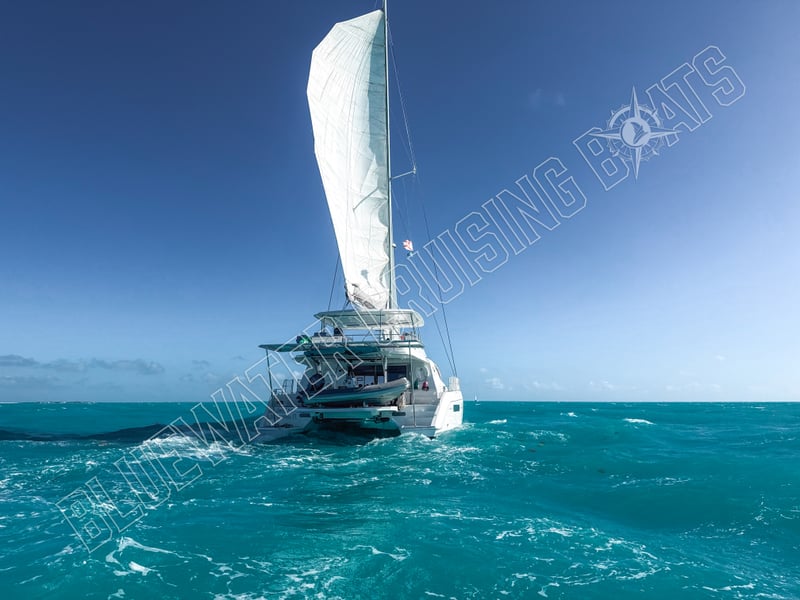 2020 Robertson and Caine Leopard 58 catamaran sailing with white sails in turquoise waters